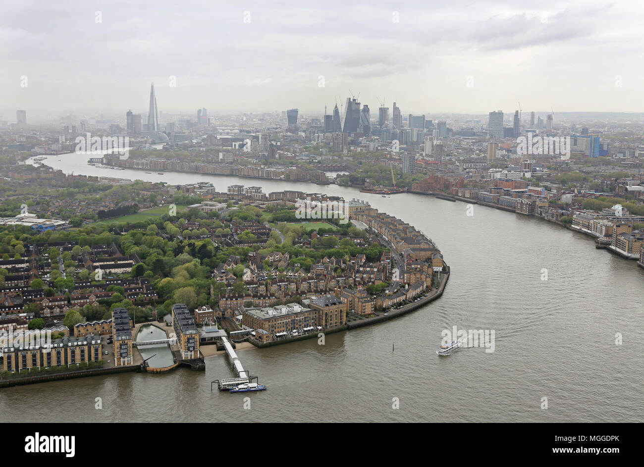 High level view of the River Thames from Canary Wharf, view west towards the City of London. Overcast April morning. Shows Rotherhithe in foreground. Stock Photo