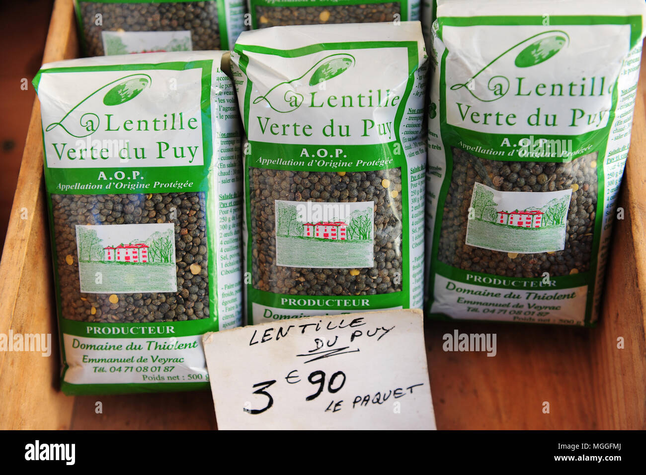 Bags of Le Puy green lentils for sale at the local fruit and veg market in the city of Le-Puy-en-Velay, France Stock Photo