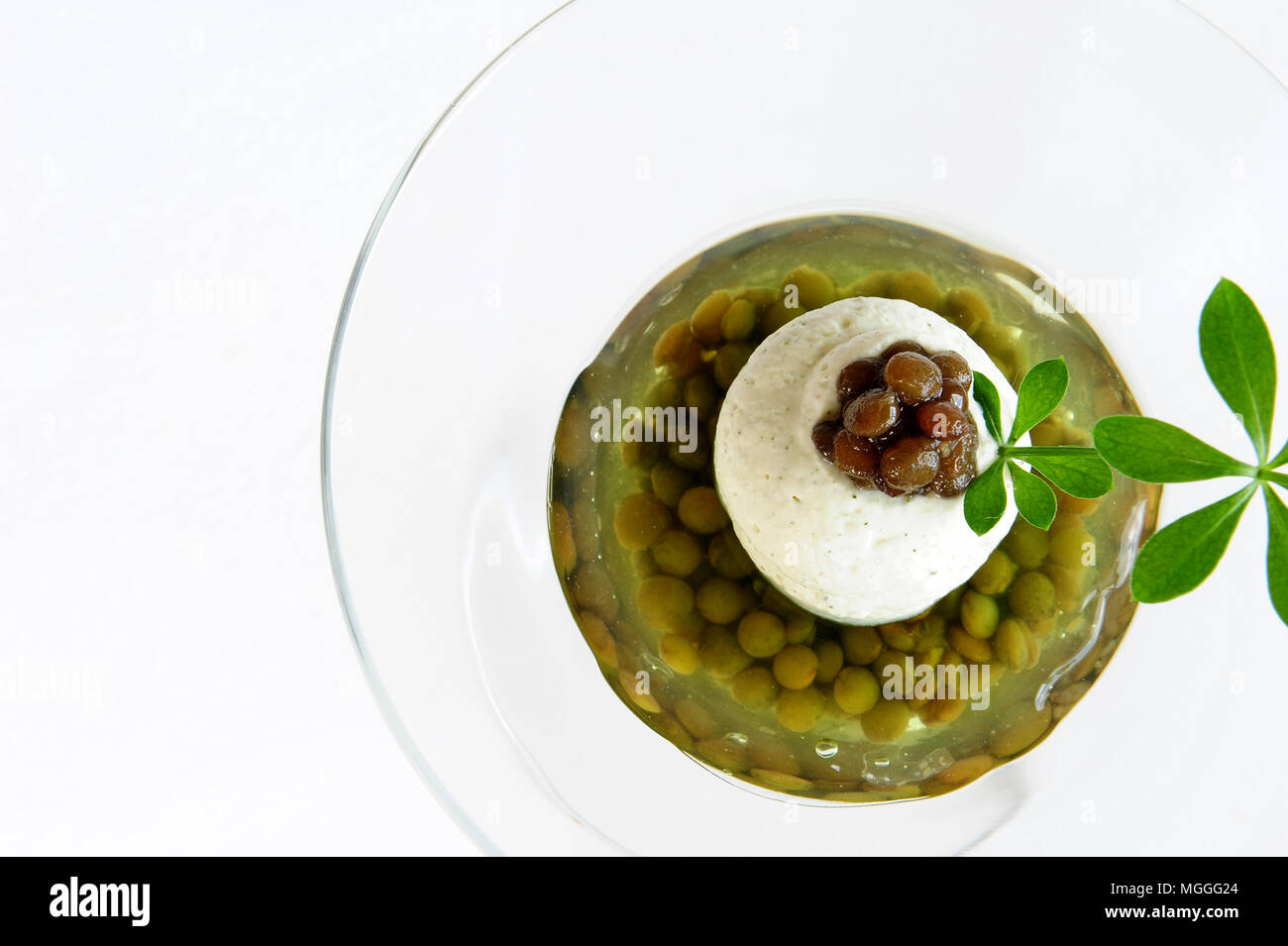 A Puy lentil-based dessert created by Michelin-starred chef Régis Marcon (lentilles vertes du Puy confites à la vanille et gelée d'asperule odorante) Stock Photo