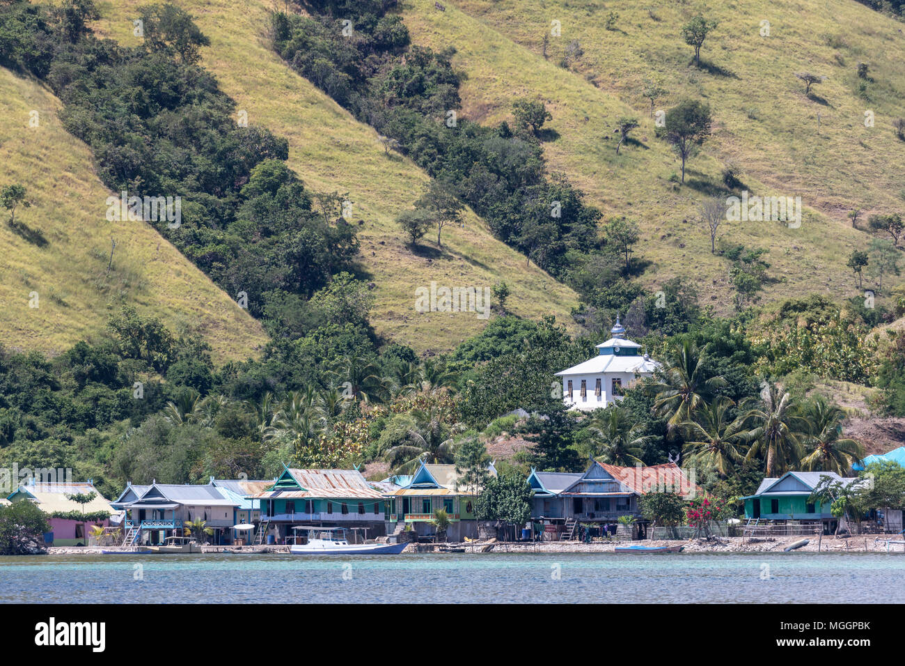 Mosque on hilltop above fishing village on Flores Island near Labuan Bajo, Indonesia Stock Photo