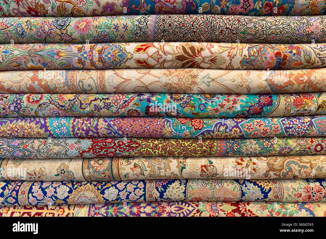 Pile of Persian rugs in Tehran, Iran Stock Photo