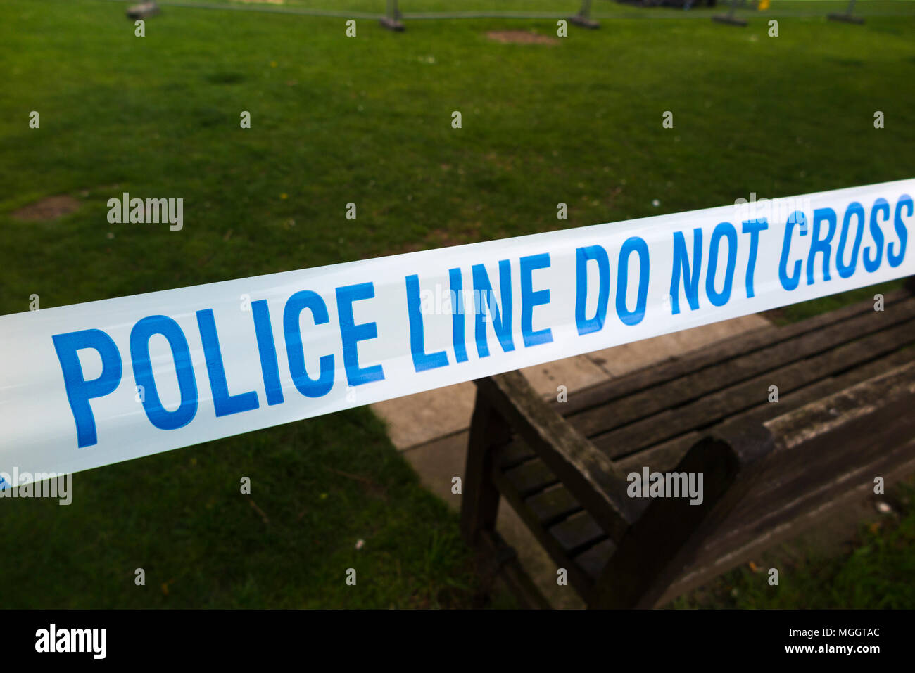 Police Line Do Not Cross tape barrier, typically placed around a crime ...