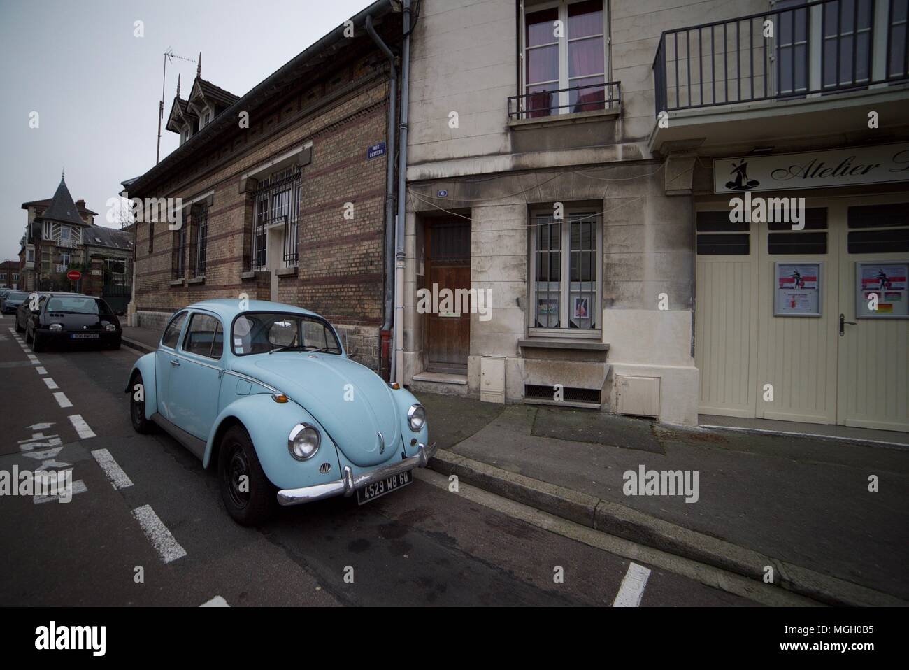 1960's Light blue Volkswagen Beetle parked up on an old street in Paris (Beetle parked on road) Stock Photo