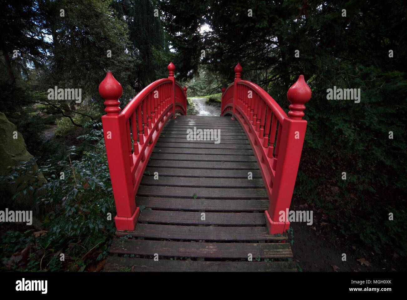Traditional Asian red wooden bridge at parc boulogne-edmond de rothschild Stock Photo