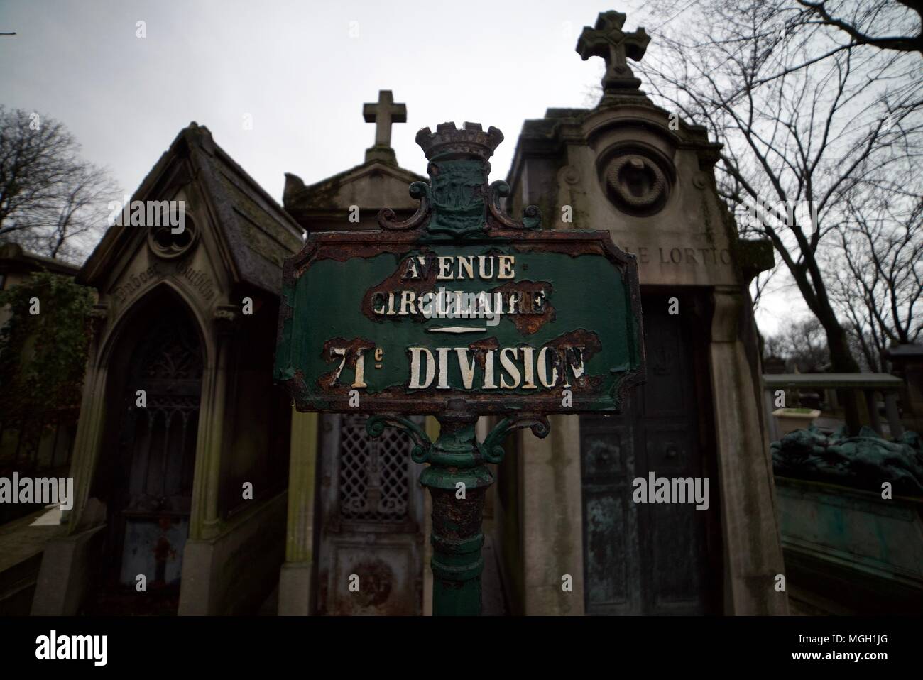 Direction sign for the different sections of the Pere-Lachaise Cemetery in Paris indicating the different rows of tombs and grave stones. Stock Photo