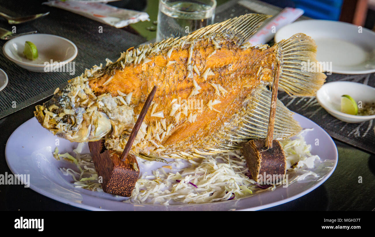 elephant ear fish grilled, a specialty on the Mekong Delta in Vietnam Stock Photo