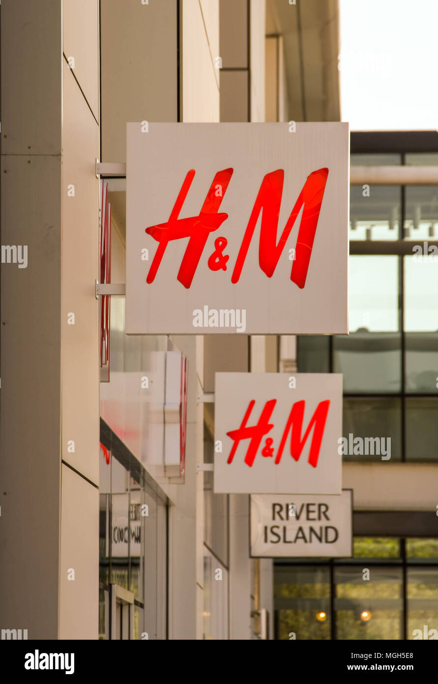 Large sign over the entrance to a H&M store on a retail park Stock Photo