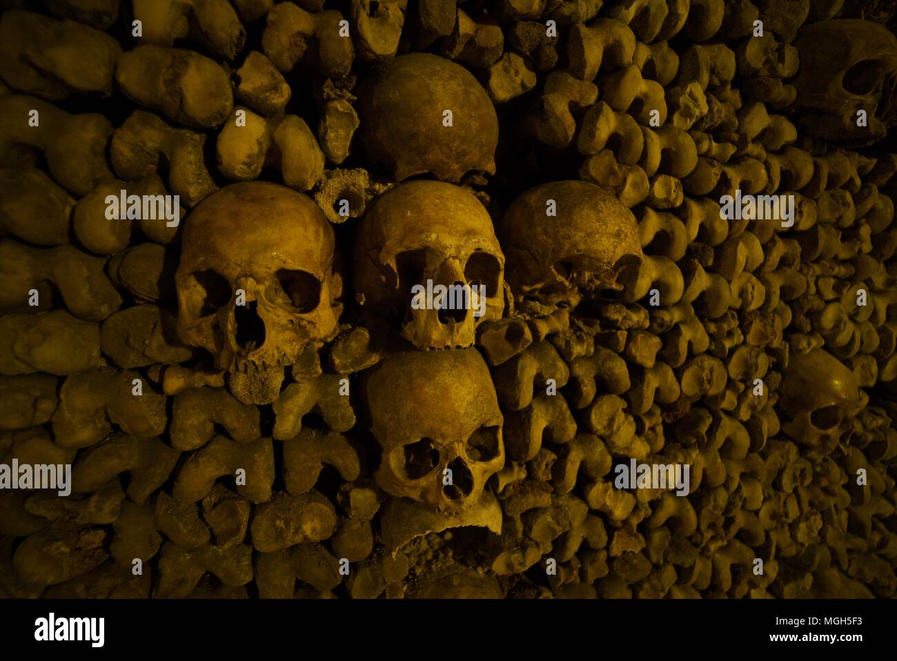 Wall of bones in the paris catacombs Stock Photo