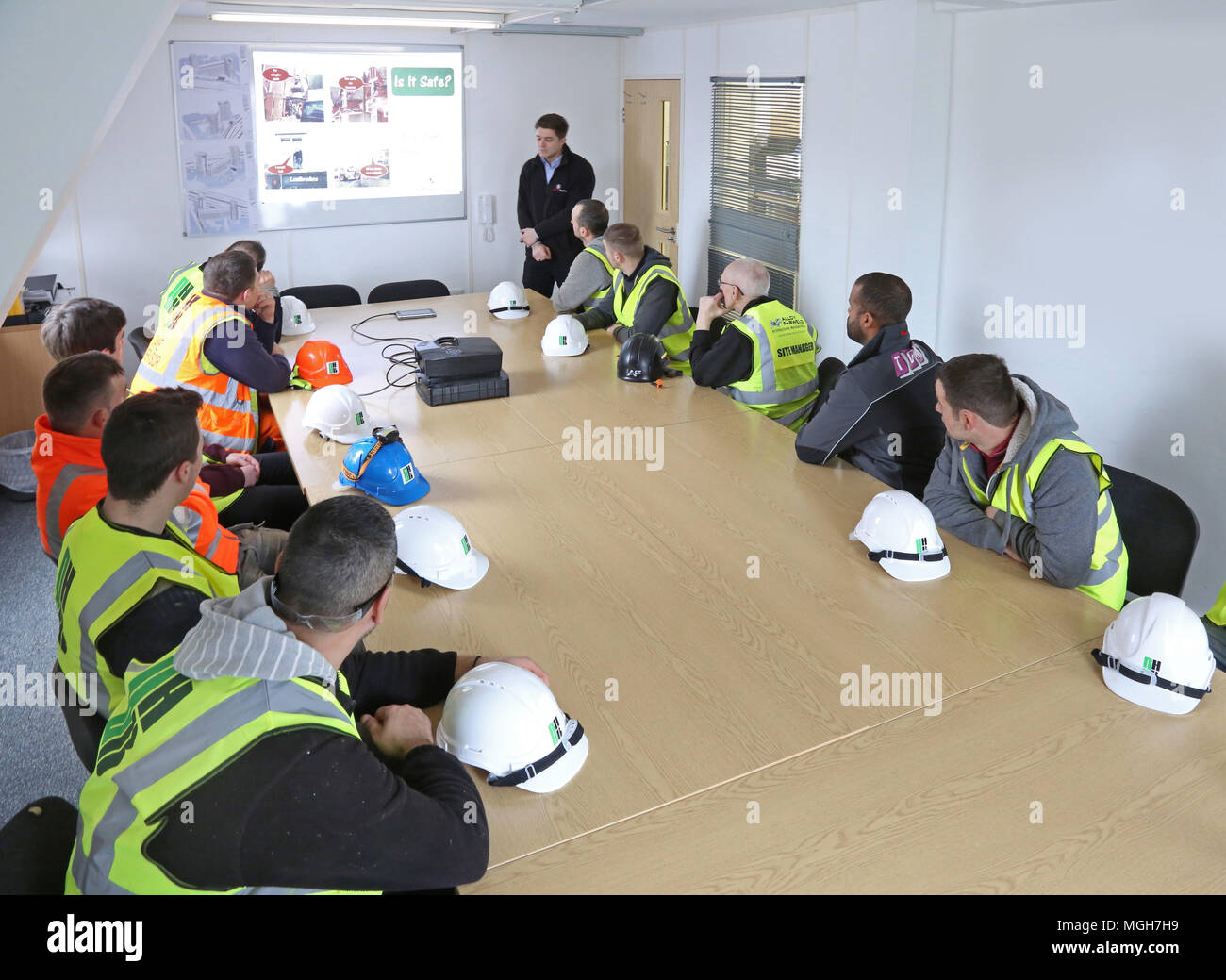 A construction site health and safety briefing takes place in in London