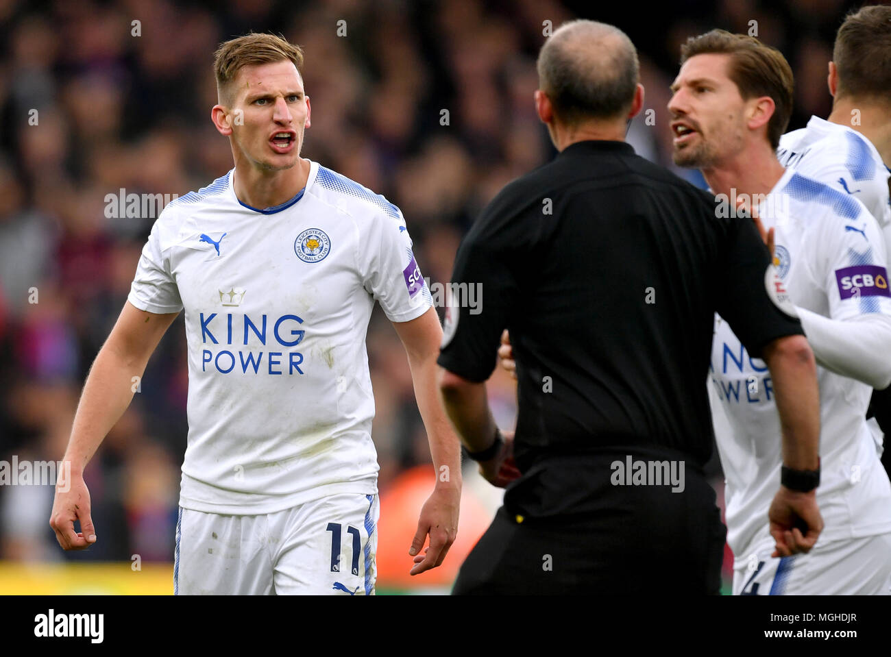 Leicester City's Marc Albrighton (left) reacts after receiving a red card from Referee Mike Dean during the Premier League match at Selhurst Park, London. Stock Photo