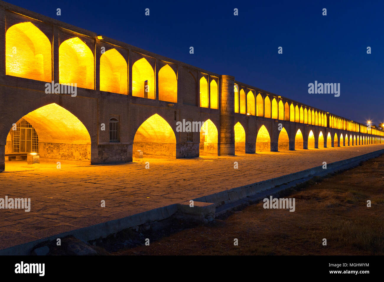 Siosepol Bridge in Isfahan, Iran, at the twilight. The river is missing due to the shortage of rain fall, April 2018 Stock Photo