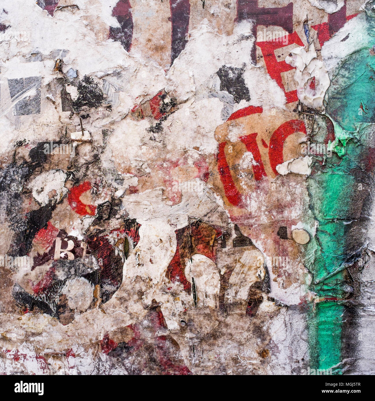 Urban Collage / Décollage. Remnants of torn posters on wall, London, UK Stock Photo