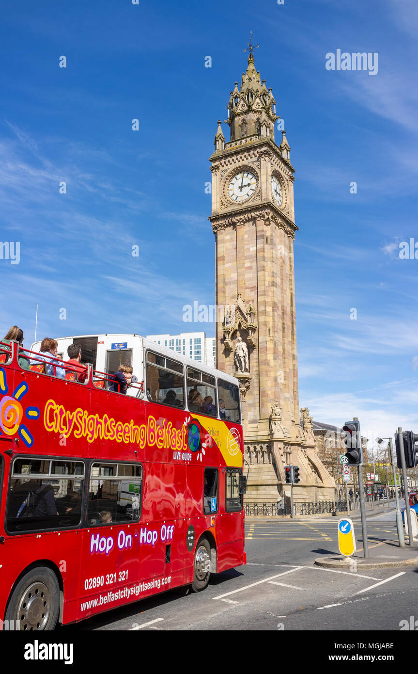 A Belfast Hop On, Hop Off tour bus approaches the Albert Memorial Clock Stock Photo Alamy
