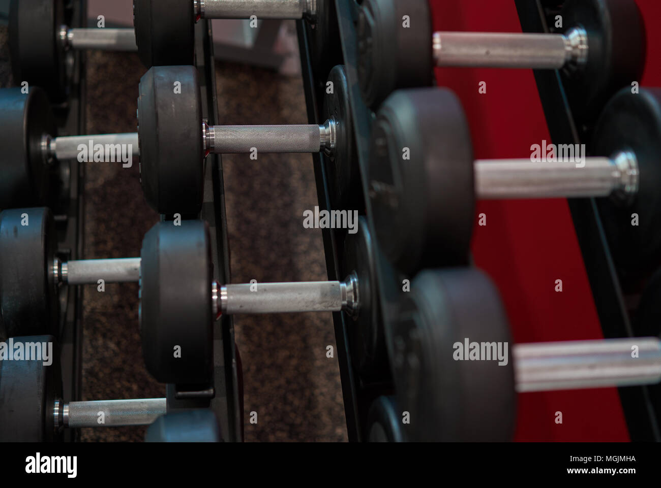 number of dumbbells on the rack Stock Photo - Alamy