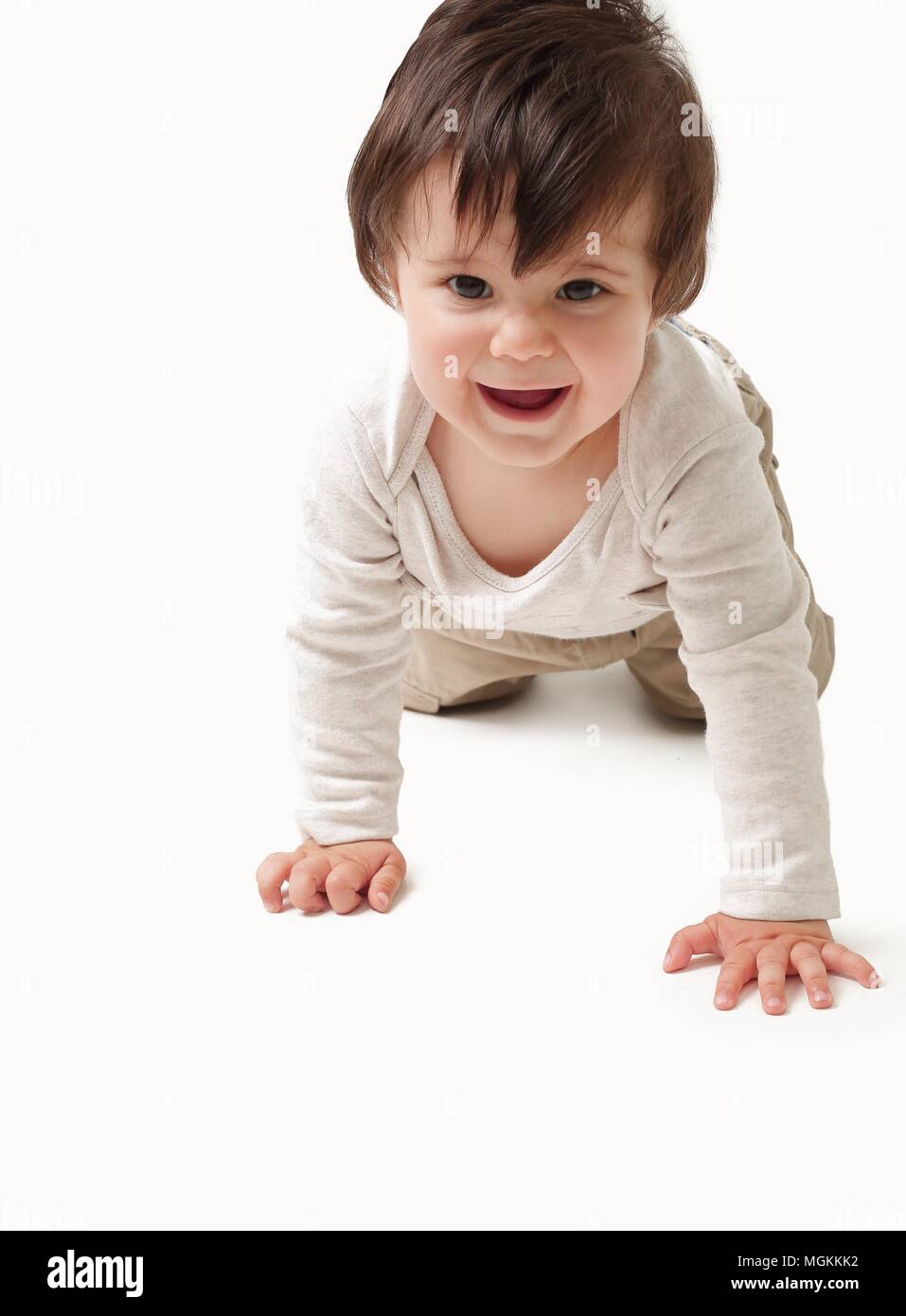 the baby learns to crawl isolated on white background Stock Photo - Alamy