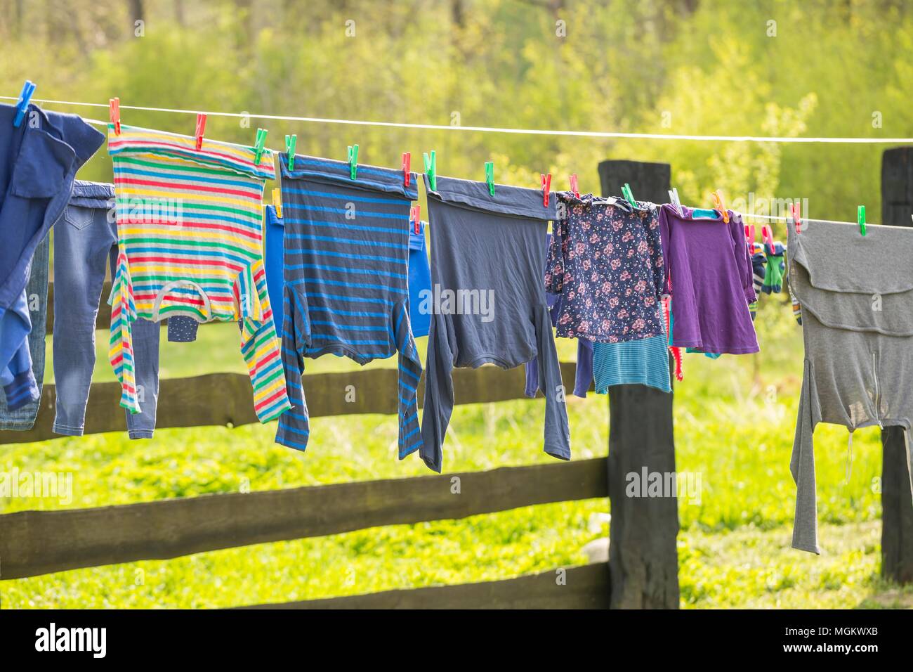 Washing line with drying clothes in outdoor. Clothes hanging on