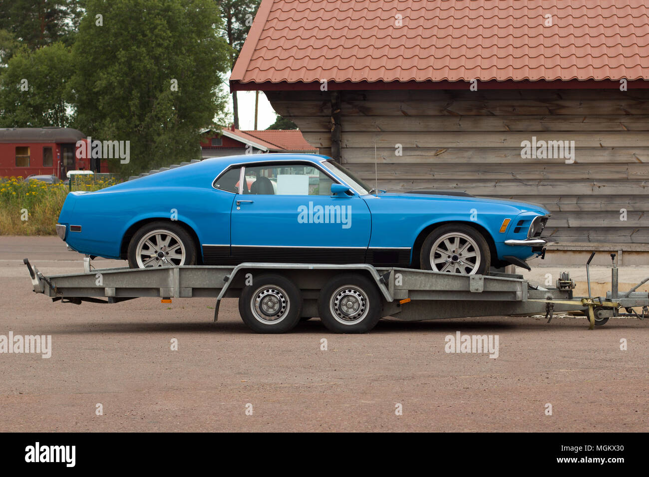Truck in old car assistance. Car on a flatbed truck. Car carrier trailer. Stock Photo