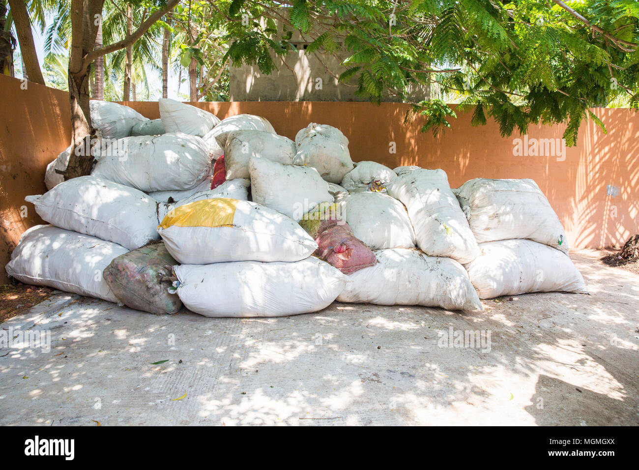 Big bags of waste plastic bottles and other types of plastic waste at the waste disposal site