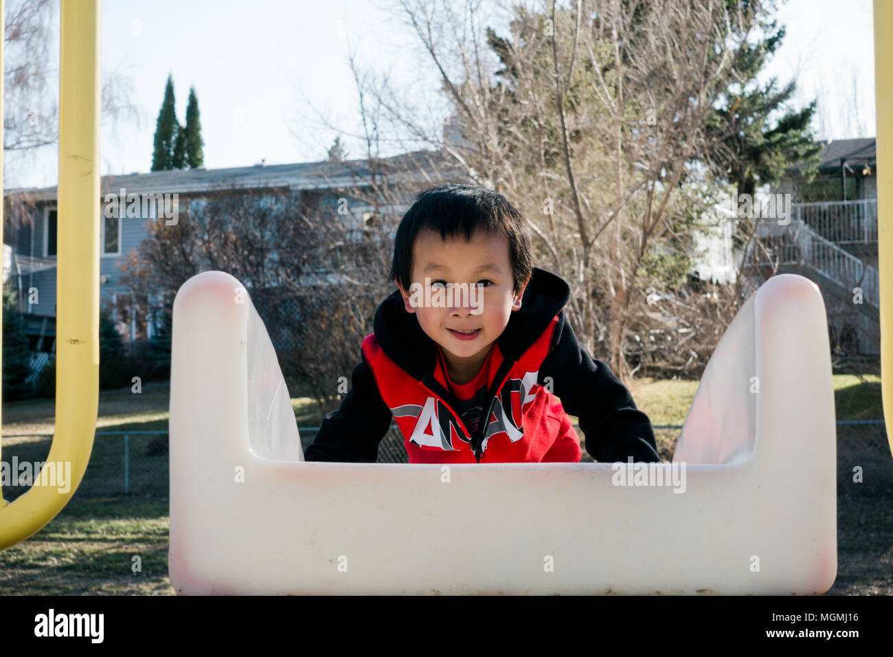 a cute little boy playing on the playground Stock Photo - Alamy