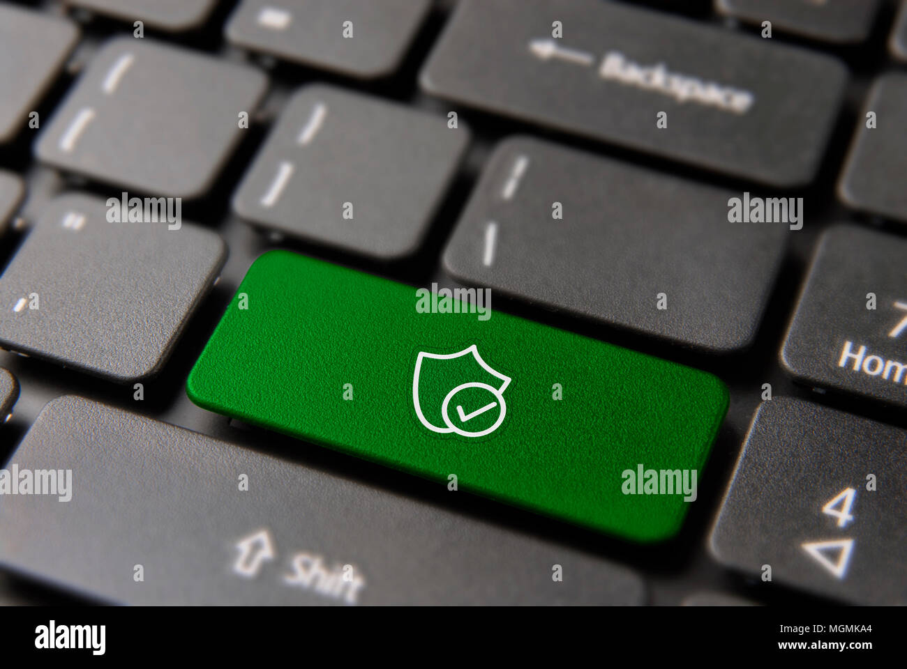 Business cyber security computer button for internet safety concept. Shield protection icon key in green color. Stock Photo