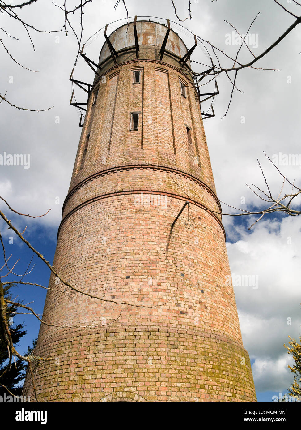 Cambridge landmark from point of view tall orange brick water tower on outskirts of town, New Zealand Stock Photo