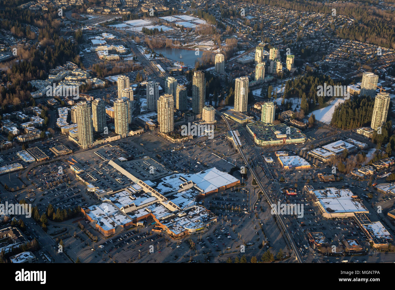 Vancouver, British Columbia, Canada - February 22, 2018: Aerial view of Coquitlam Centre Mall during a vibrant winter sunset. Stock Photo