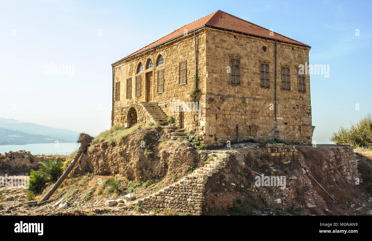 Traditional Lebanese house over the Mediterranean sea, Byblos, Lebanon. The house is within the antiquities complex and illustrates the modern ground  Stock Photo