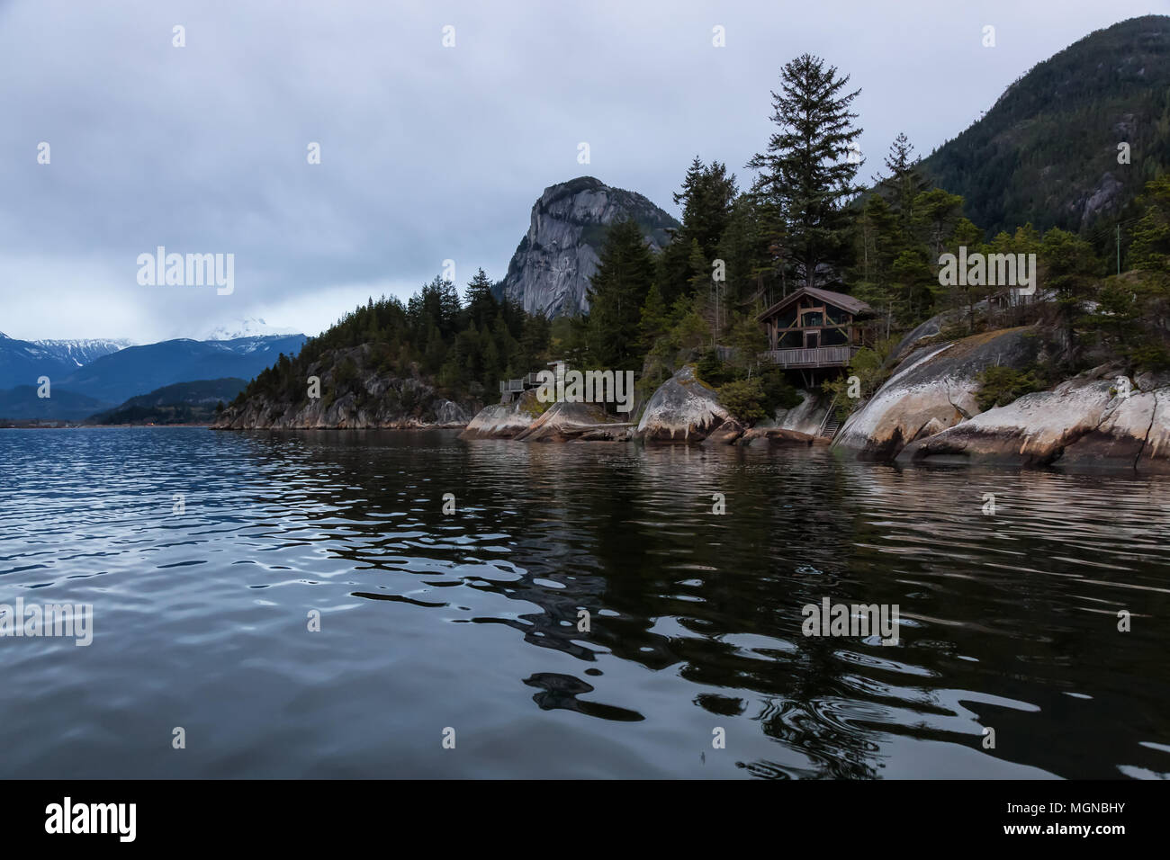 Beautiful View Of Wooden Cabins On A Rocky Shore Overlooking The