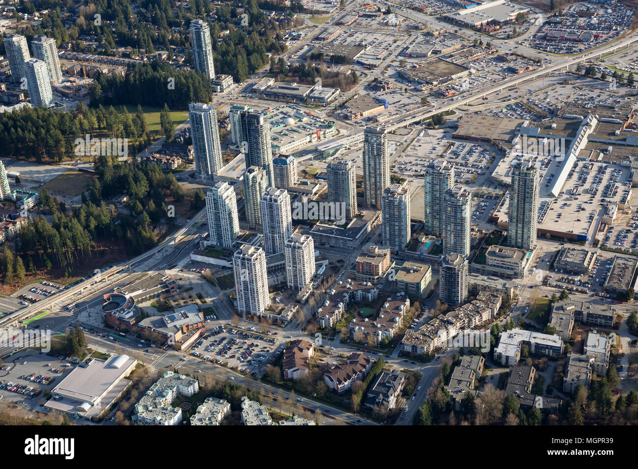 Coquitlam, Greater Vancouver, British Columbia, Canada - March 9, 2018: Aerial view of Residential Buildings and Shopping Mall. Stock Photo