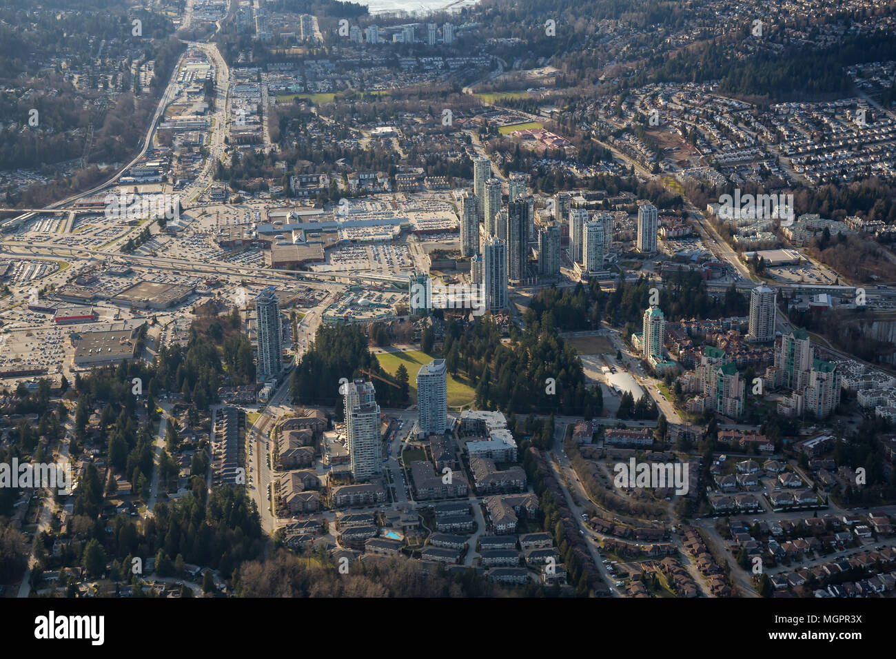 Aerial view of Coquitlam Centre Shopping Mall during a sunny day. Taken in Greater Vancouver, British Columbia, Canada. Stock Photo