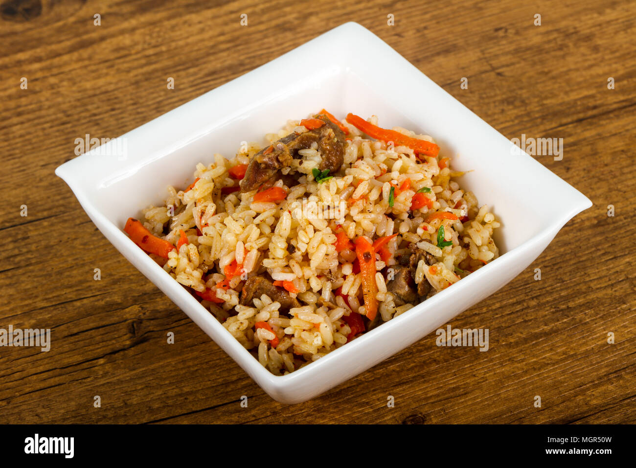 Asian rice - Plov with meat and carrot Stock Photo - Alamy