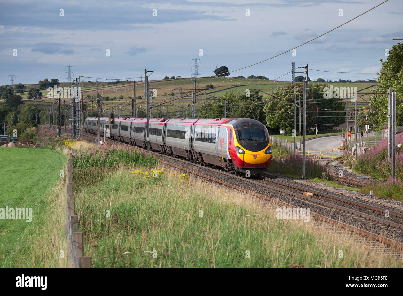 A Virgin trains west coast Pendolino train at  Hardendale, Shap, Cumbria on the west coast main line Stock Photo