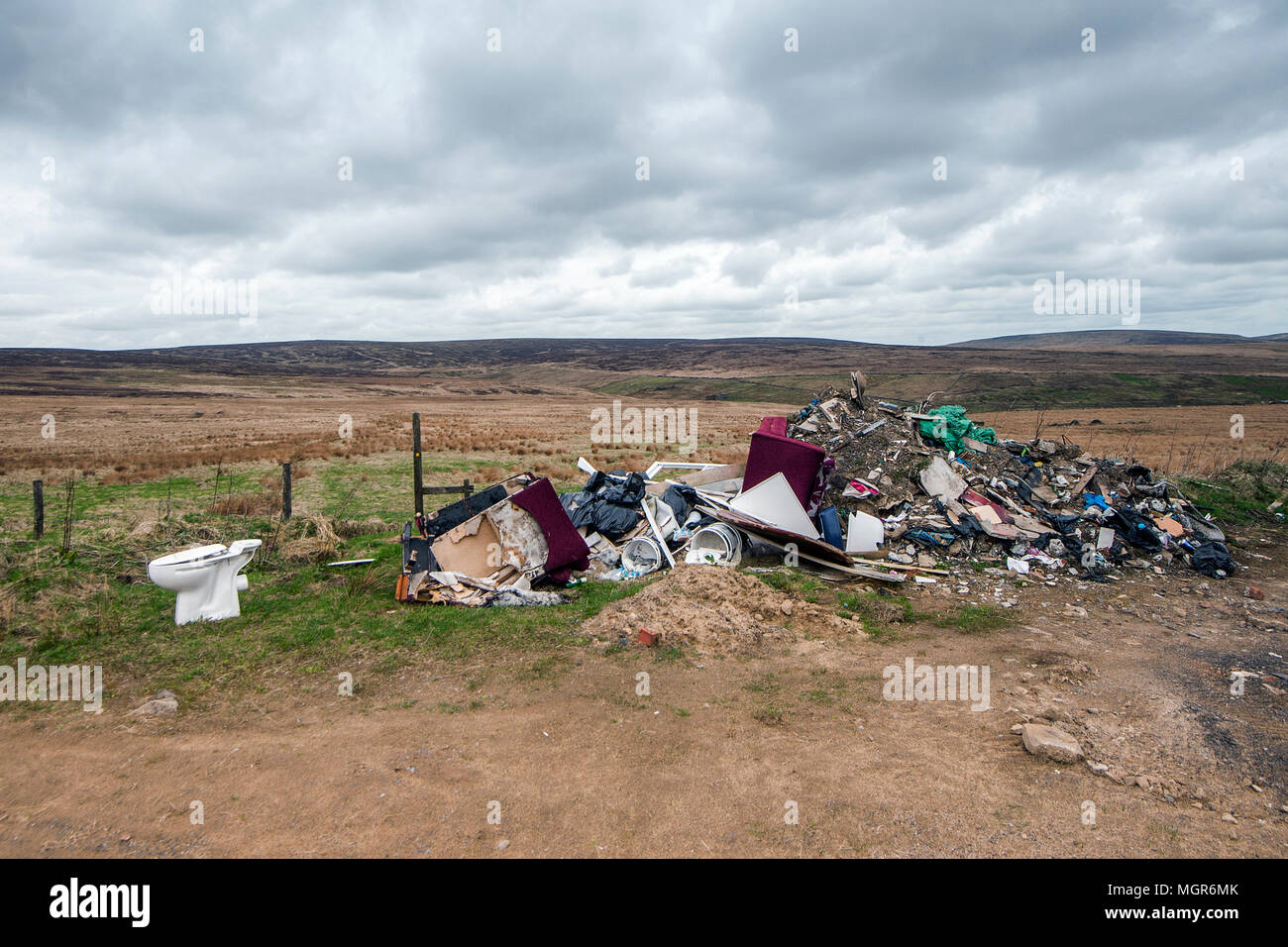 household rubbish discarded on a remote moorland location Stock Photo