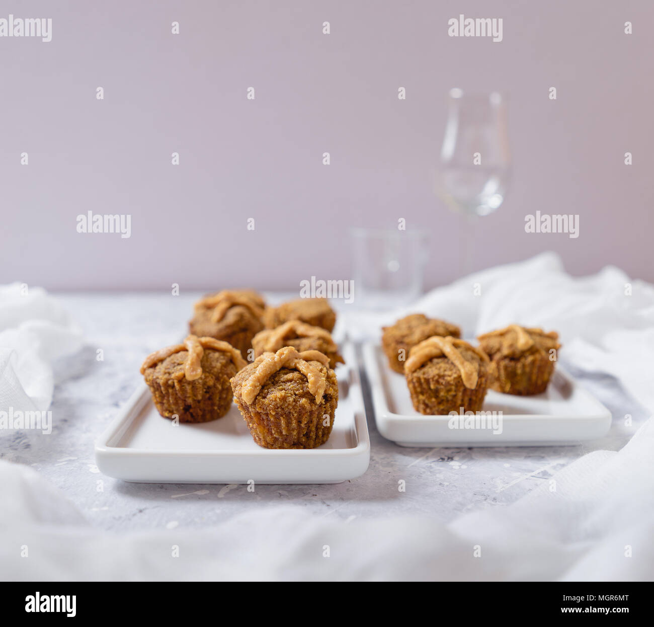 Hot Cross Muffins for Easter, brightly lit table scene Stock Photo