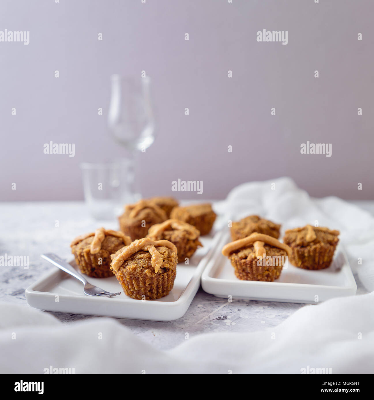 Hot Cross Muffins for Easter, brightly lit table scene Stock Photo