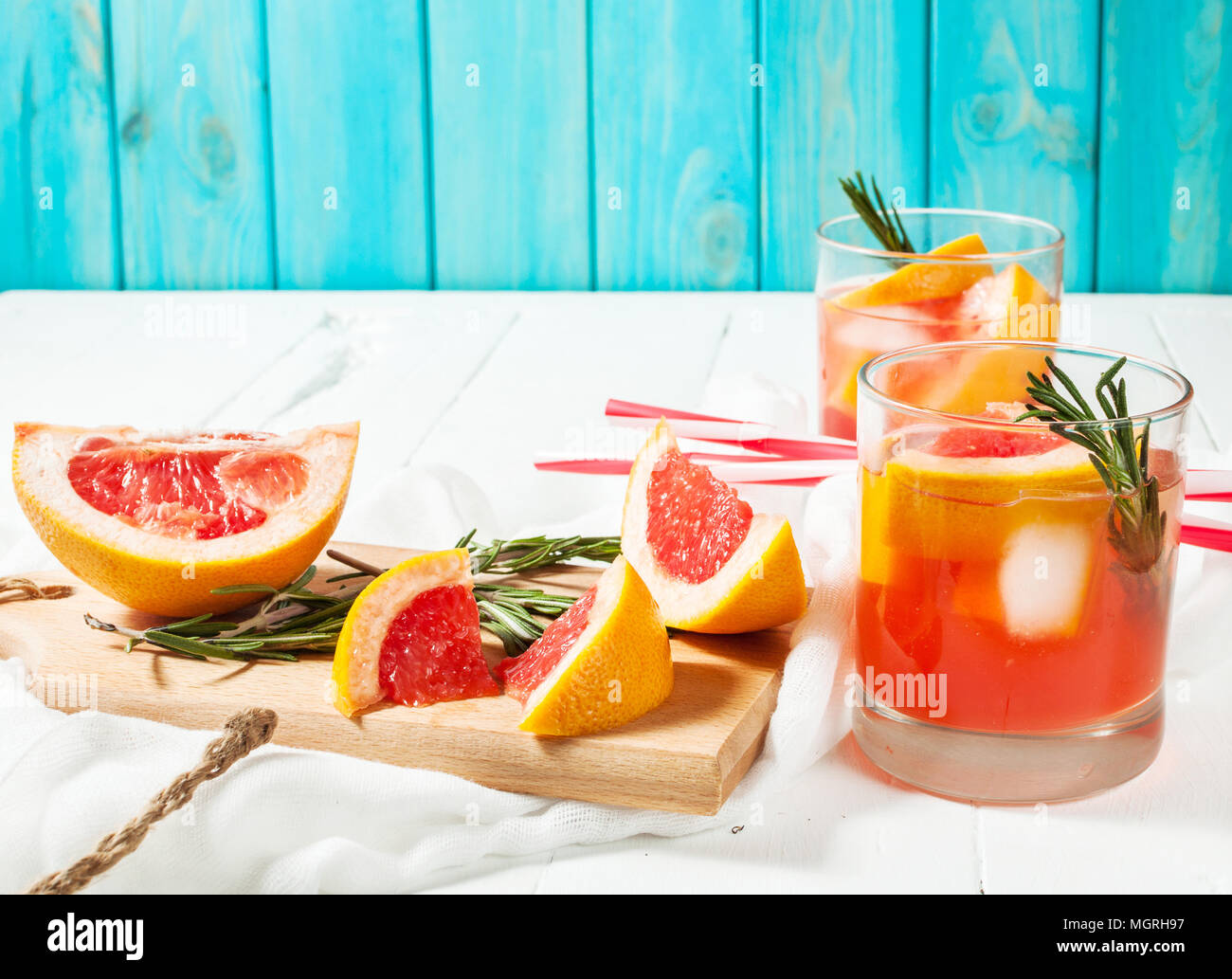 Grapefruit and rosemary gin cocktail, refreshing drink with ice Stock Photo Alamy