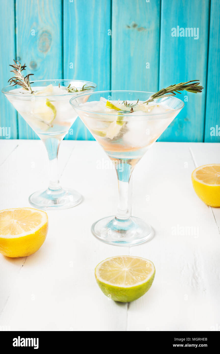 Gin, lemon, rosemary fizz, cocktail with honey and fresh herbs on a