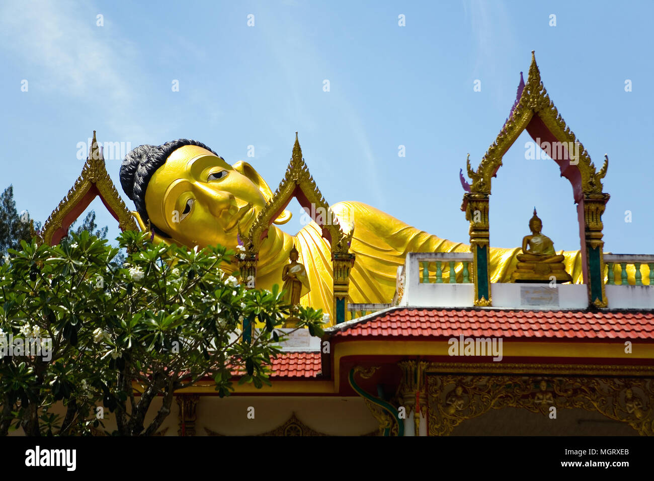 Sculpture of the Great Golden reclining Buddha. Thailand. Stock Photo