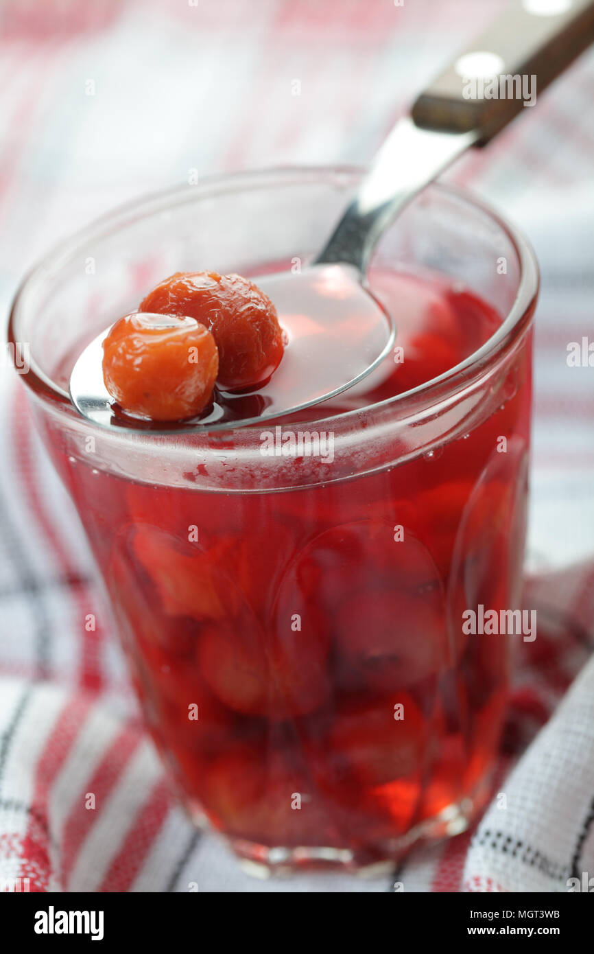 Sour cherry compote in the rustic glass closeup Stock Photo Alamy