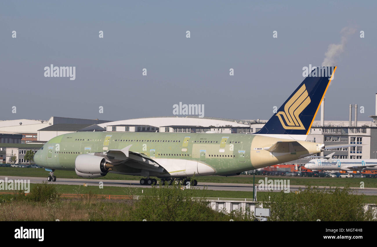 Hamburg, Germany - April 27, 2018: Airbus A380 landing at the Airbus Plant in Hamburg Finkenwerder after a test flight Stock Photo
