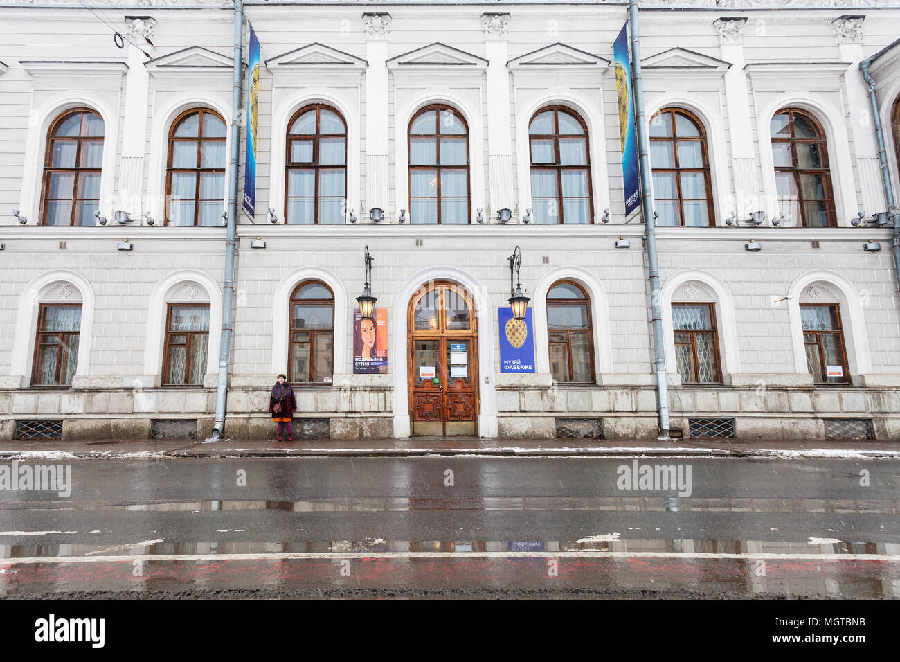 SAINT PETERSBURG, RUSSIA - MARCH 19, 2018: visitor near Faberge Museum in Shuvalov Palace on Fontanka River Embankment in Saint Petersburg in snow. Th Stock Photo