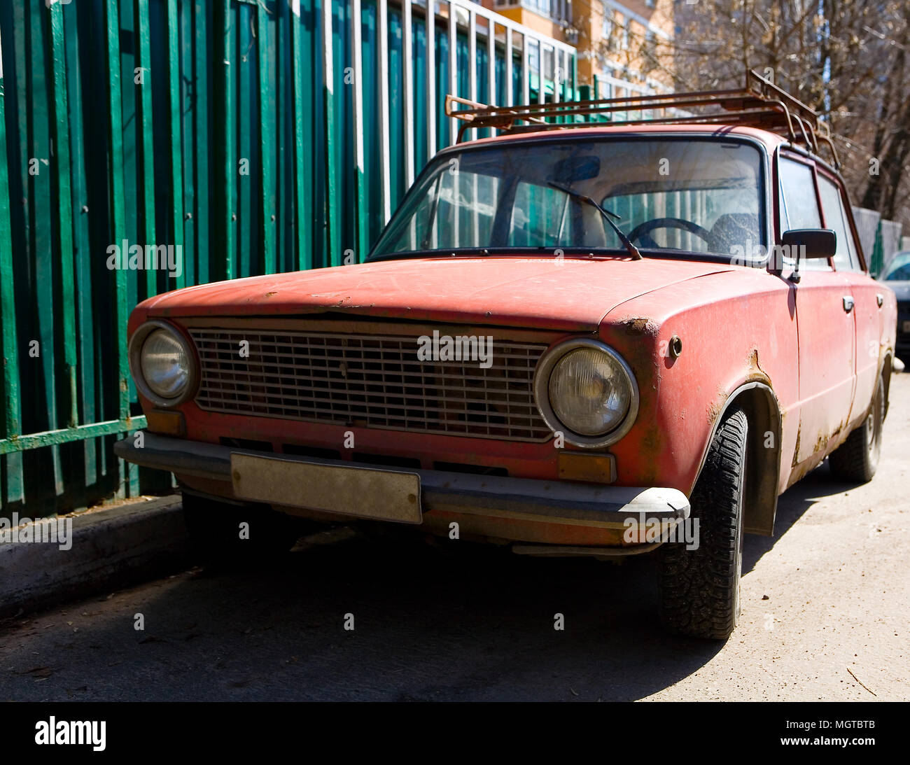 Parked old rusty red Soviet car. Without people Stock Photo - Alamy