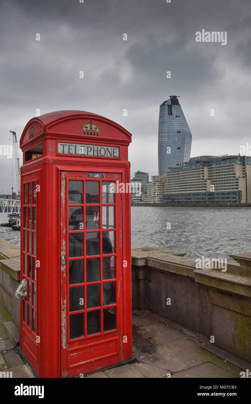 red telephone box on the embankment london Stock Photo