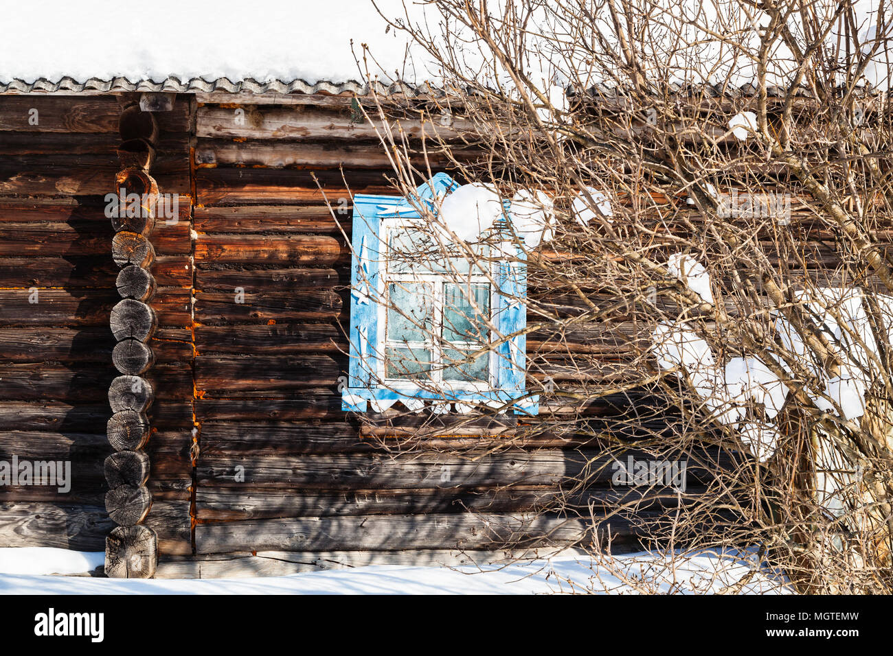 wooden wall with carved window of old typical russian rural house in ...