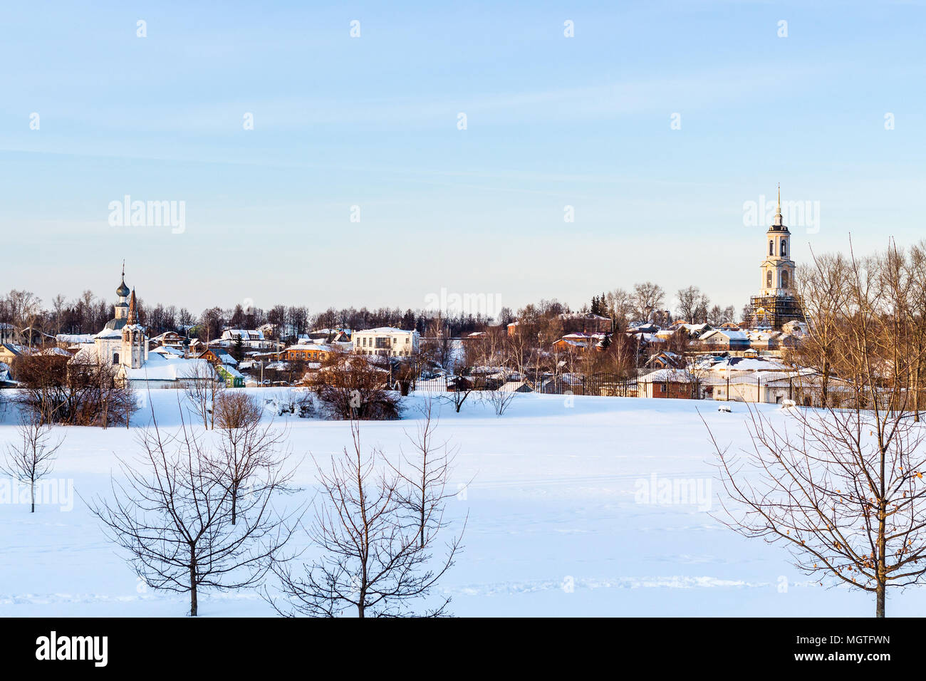 cityscape of Suzdal town with Holy Cross Exaltation and St Cosmas and St Damian Churches in Korovniki district and Prepodobenskay Bell Tower of Deposi Stock Photo