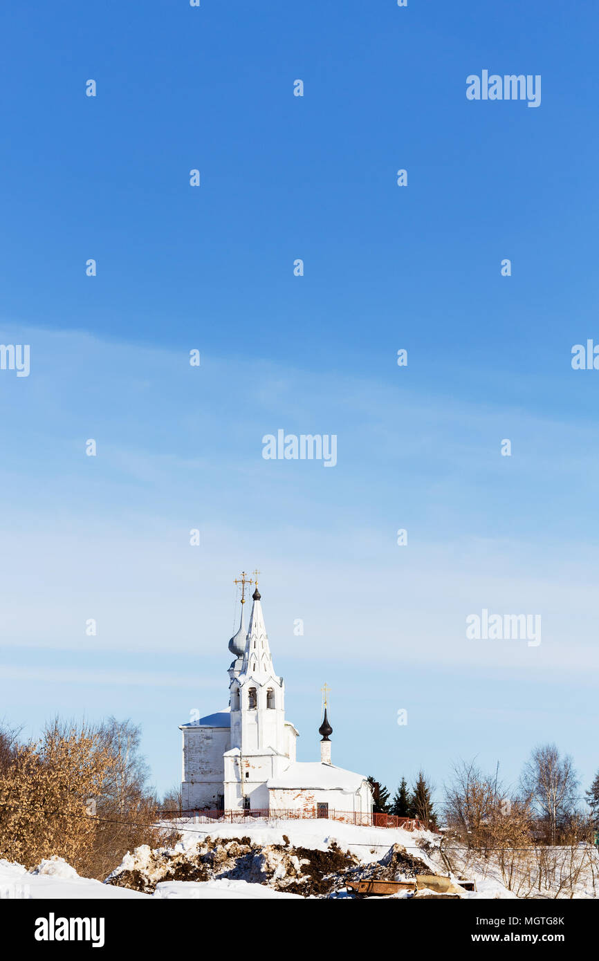 view of Church of Saints Cosmas and Damian (Kozmodemyanskaya Church) on Yarunova Hill from ravine in Suzdal town in winter in Vladimir oblast of Russi Stock Photo