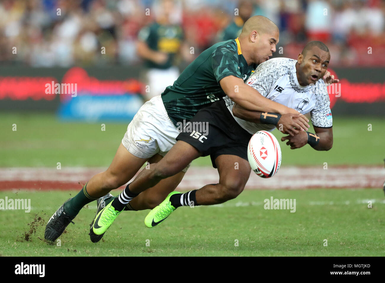 Singapore. 29th Apr, 2018. Alasio Sovita Naduva of Fiji (right) is tackled by Zain Davids of South Africa during the Cup Semi Final match between Fiji and South Africa at the Rugby Sevens tournament at the National Stadium. Singapore. Credit: Paul Miller/ZUMA Wire/Alamy Live News Stock Photo