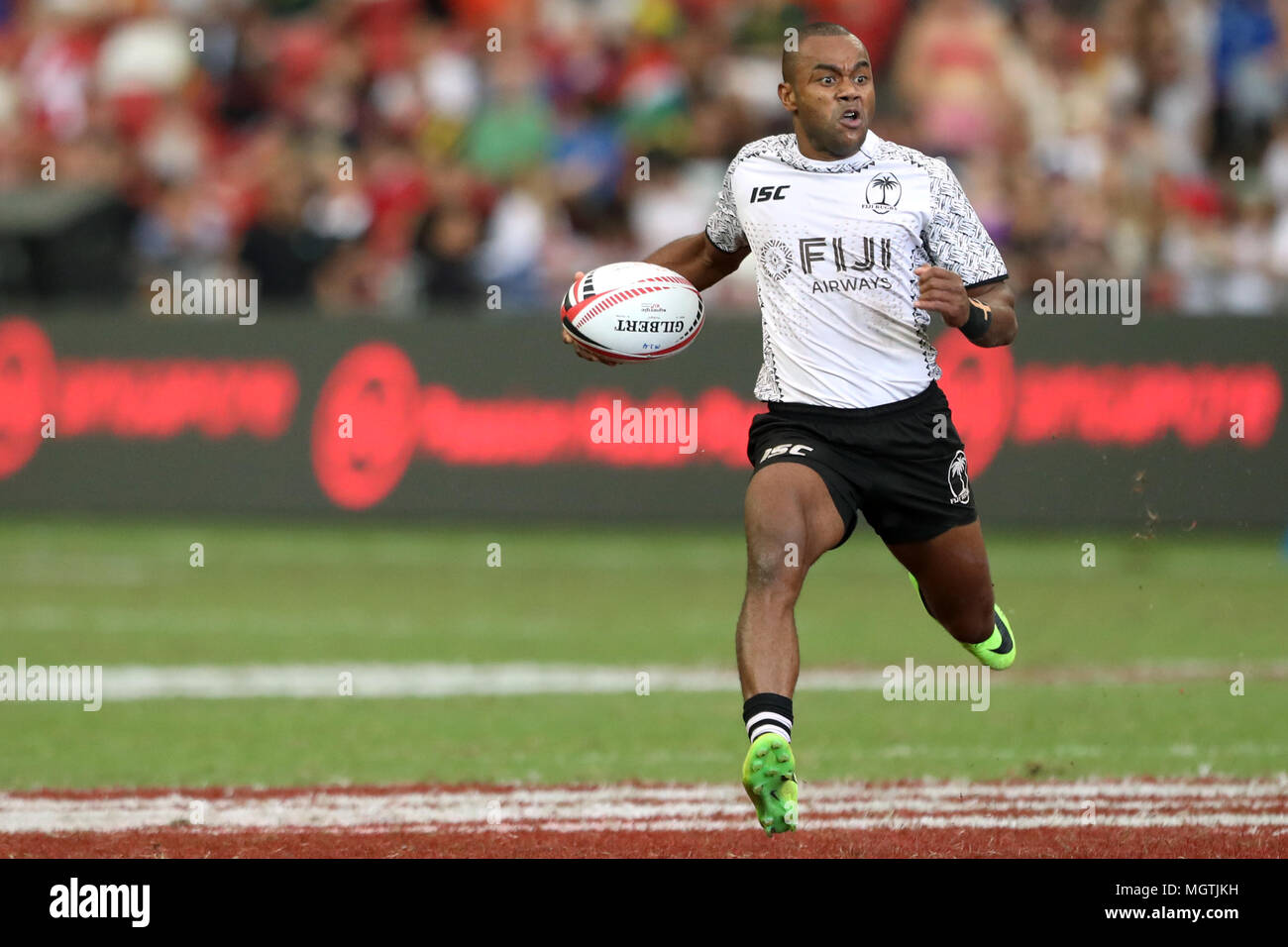 Singapore. 29th Apr, 2018. Alasio Sovita Naduva of Fiji runs with the ball during the Cup Semi Final match between Fiji and South Africa at the Rugby Sevens tournament at the National Stadium. Singapore. Credit: Paul Miller/ZUMA Wire/Alamy Live News Stock Photo
