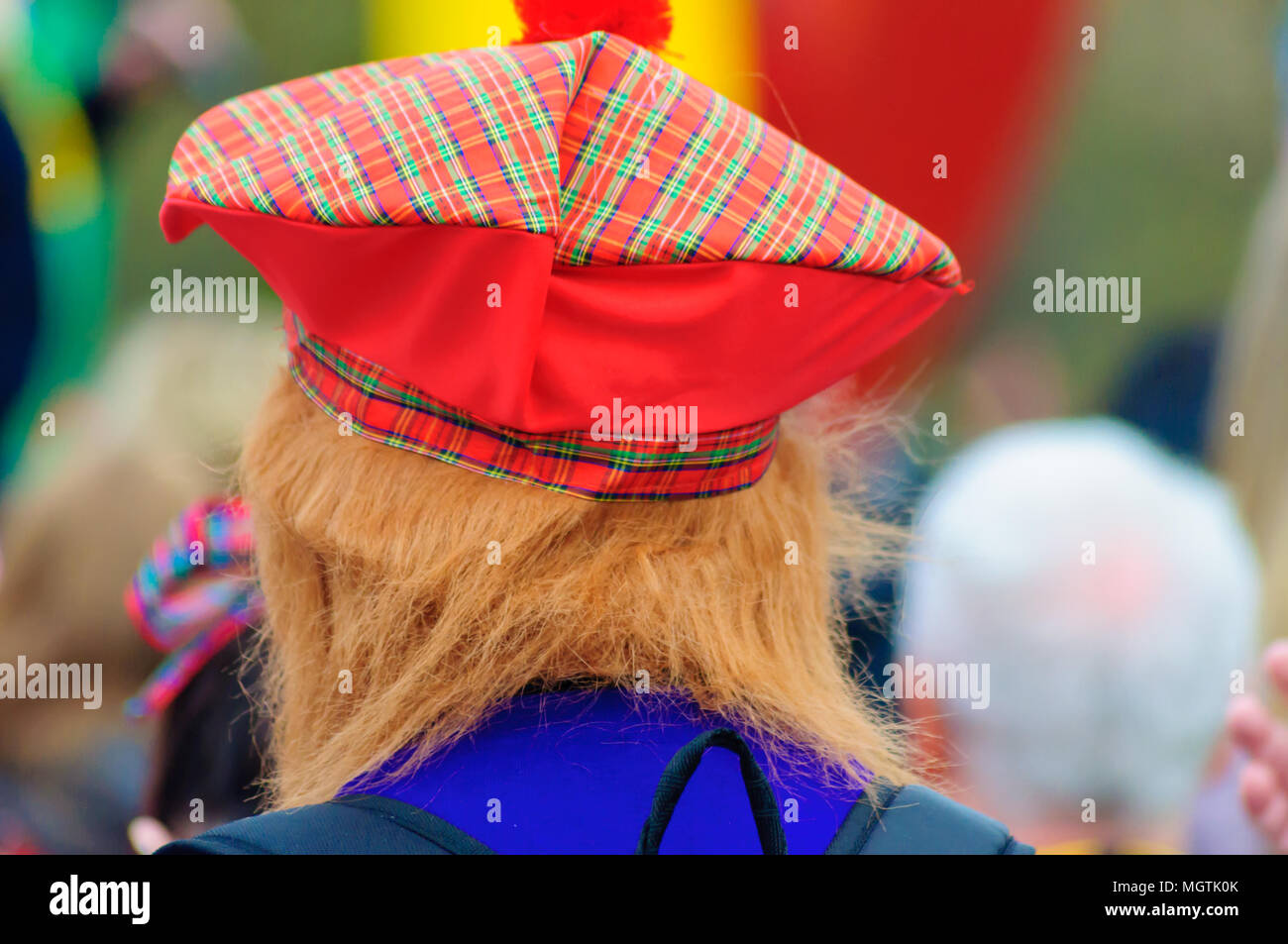 Glasgow, Scotland, UK. 29th April, 2018. The back of a walkers head wearing a tartan hat and ginger hair, see you jimmy hat, at the start of the Kiltwalk Glasgow 2018, a charity event where walkers have three distances to choose from, a Mighty Stride (23 miles), a Big Stroll (14 miles) or the Wee Wander (6 miles). This year involved 10,000 walkers and raised two million pounds for 600 charities. Credit: Skully/Alamy Live News Stock Photo