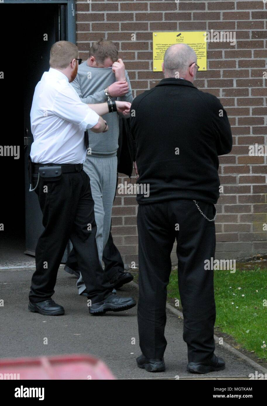 Wales UK,  28th April 2018  Murder suspect Christopher Llewellyn Kerrell is led from court in Merthyr Tydfil after the first hearing of the Hollie Kerrell case. Credit: Barry Bullough/Alamy Live News Stock Photo